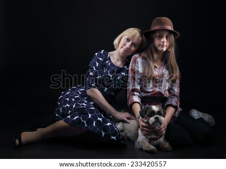 Mom and daughter with her dog