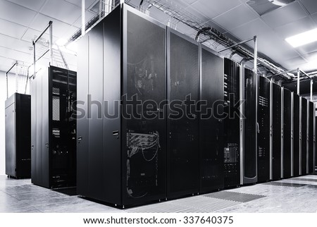 room with rows of server hardware in the data center