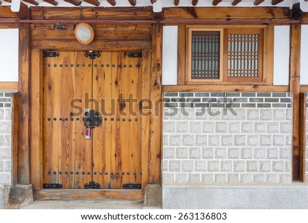 Wooden door korean house style at Bukchon historic district in Seoul, South Korea