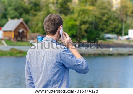 back man talking on the phone