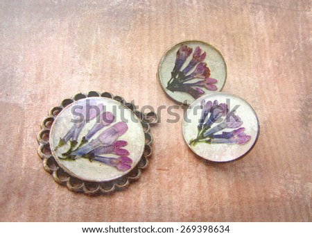 Beautiful handmade vintage pendant and earrings with flowers the lilac buds in resin.