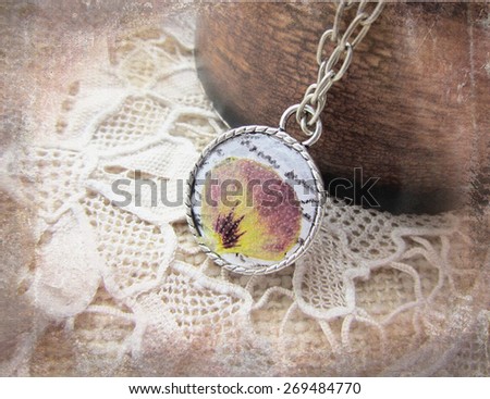 Beautiful handmade pendant with flowers in resin