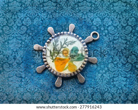 Beautiful pendant with flowers in resin. Women\'s jewelry, accessory.