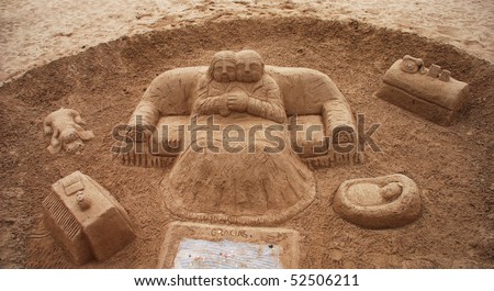 An abstract art sculpture in the sand on a spanish beach