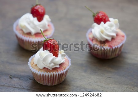 strawberry cupcake with Strawberry,Top these delightful strawberry cupcakes with Strawberry and whipped cream