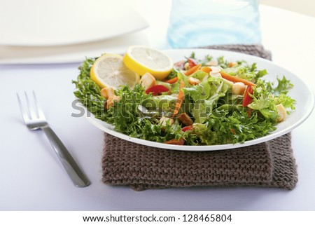 Salad with French dressing,lemon,almond,carrot,bell pepper