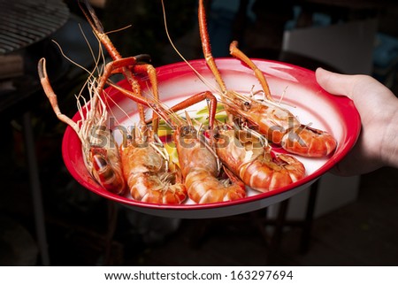 Served BBQ Grilled Prawns in a party.