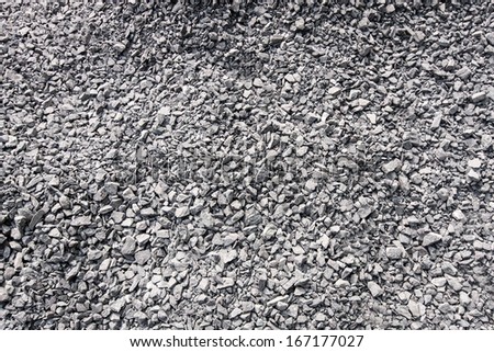 Crushed gravel background. Closeup of granite gravel texture