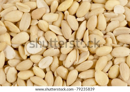 Heap of peeled almonds, seen from directly above and in full frame