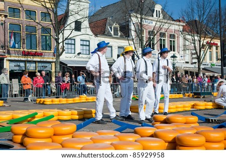 ALKMAAR, NETHERLANDS - APRIL 8: Cheese carriers at the traditional cheese market, Alkmaar, Netherlands on April 8, 2011. The market is open on Friday mornings from April to September in the city center.