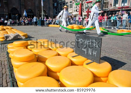 ALKMAAR, NETHERLANDS - APRIL 8: Unidentified cheese carriers at the traditional cheese market, Alkmaar, Netherlands on April 8, 2011. The market is open on Friday mornings from April to September in the city center.