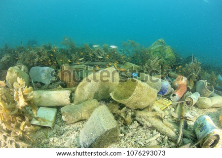 Plastic ocean pollution. Plastic bags, bottles, straws and cups pollute the sea. Underwater reef environmental problem