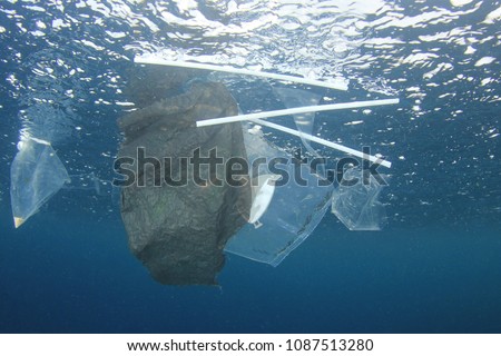 Plastic bags and straws pollution in ocean