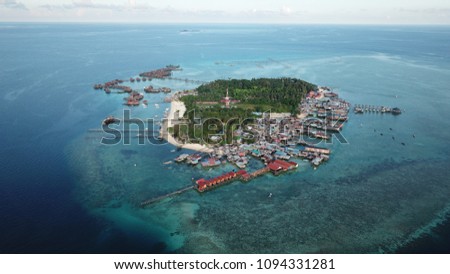 Mabul Island, Malaysia. Islands like this are endangered by climate change and rising sea levels