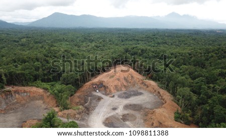Deforestation aerial photo. Rainforest jungle in Borneo, Malaysia, destroyed to make way for oil palm plantations