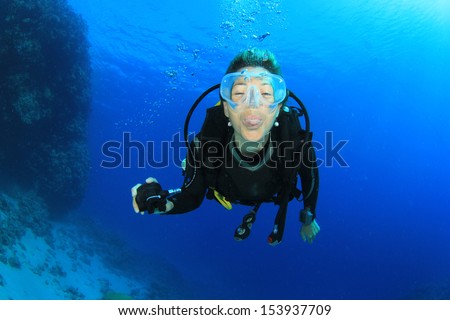 Female Scuba Diver underwater having fun