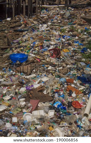 KOTA KINABALU, MALAYSIA - APRIL 26 2014: Plastic rubbish pollution in poor slum. Photo showing pollution problem of garbage thrown out with no proper trash collection or recycling.
