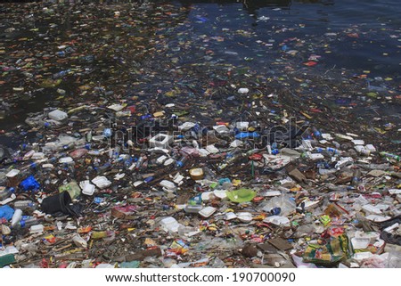 SEMPORNA, MALAYSIA - APRIL 24 2014: Plastic rubbish pollution in ocean. Photo showing pollution problem of garbage thrown directly into the sea with no proper trash collection or recycling.