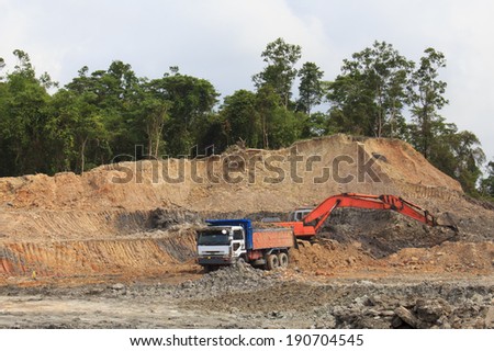 KUCHING, MALAYSIA - MAY 03 2014: Deforestation. Photo of tropical rainforest in Borneo being destroyed to make way for oil palm plantation.