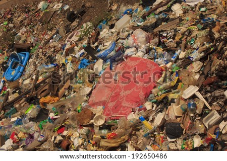 KOTA KINABALU, MALAYSIA - APRIL 26 2014: Pollution in shanty town. Photo showing environmental problem of garbage build up in poor shanty town due to lack or refuse collection or recycling.