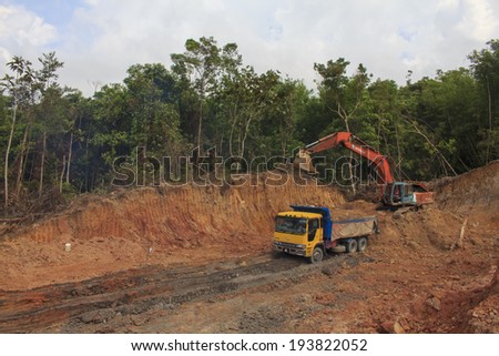 BORNEO, MALAYSIA - MAY 03 2014: Deforestation. Photo of tropical rainforest in Borneo being destroyed to make way for oil palm plantation.