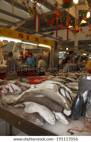 TEKKA SEAFOOD MARKET, SINGAPORE - MAY 27 2014: Sharks at fish market. Dead sharks are sold at market for their fins, used in shark fin soup, a traditional Chinese dish.