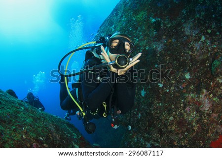 Female scuba diver having fun