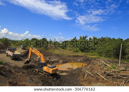 KUCHING, MALAYSIA - MAY 16 2015: Deforestation. Photo of tropical rain forest in Borneo being destroyed to make way for oil palm plantation.