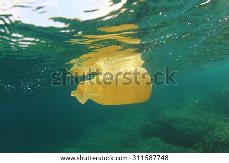 Plastic bottle disposed of in sea causes environmental damage from pollution Plastic bottle disposed of in sea causes environmental damage from pollution