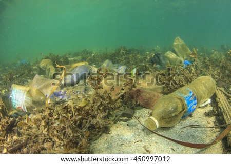 Plastic water bottles and bags pollution on sea floor