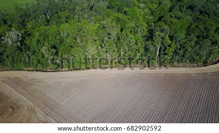 Deforestation. Aerial drone view of rainforest cleared for agriculture development