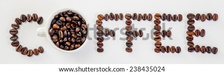 The word \'Coffee\' written with Coffee Beans on an isolated white background