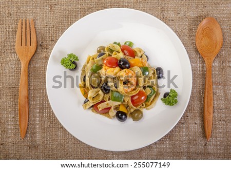 pasta with shrimps, black olives  top corner