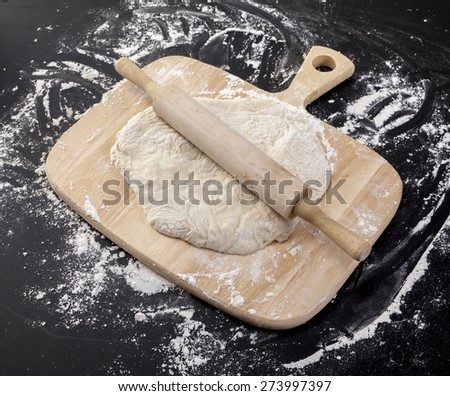 Stages of Making Bread-Flour, Dough and Loaf of Bread on  Black Background