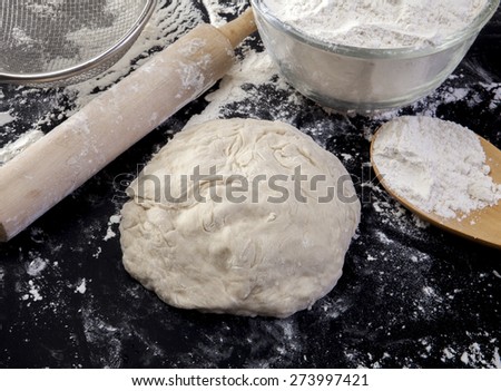 Stages of Making Bread-Flour, Dough and Loaf of Bread on  Black Background