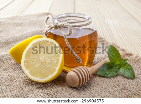 honey, lemon and ginger on a wooden background