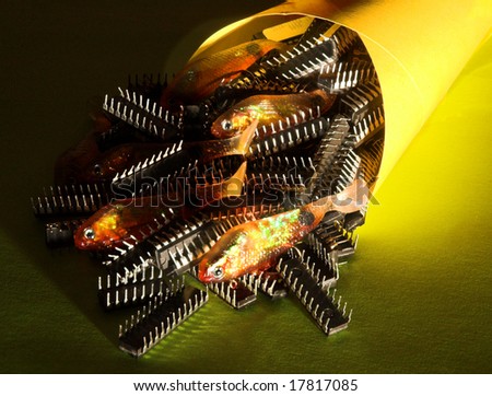 Fish and Chips - Rubber or plastic fishing lures and computer chips in a paper cone with a yellow background and side lighting.