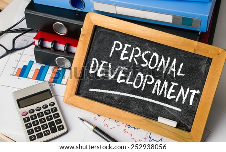 personal development concept handwritten on blackboard