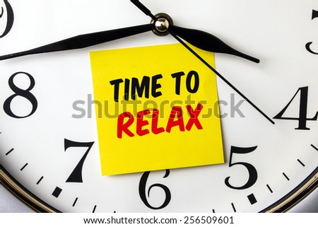 time to relax on post-it stuck to a wall clock