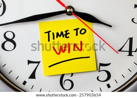 time to win on post-it stuck to a wall clock