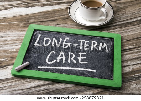 long-term care handwritten on blackboard