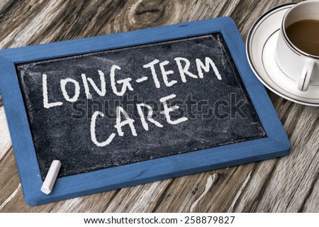 long-term care handwritten on blackboard