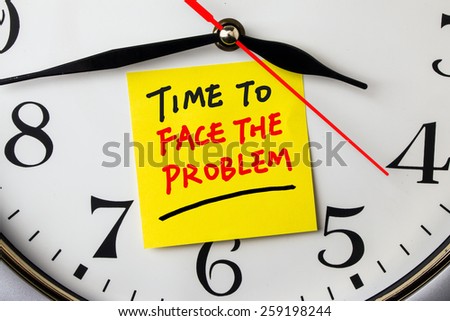 time to face the problem on post-it stuck to a wall clock