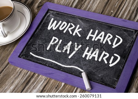 work hard play hard handwritten on chalkboard
