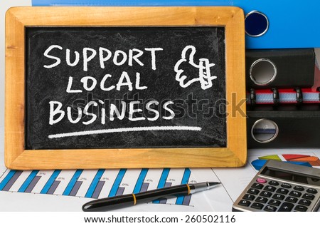 support local business handwritten on blackboard