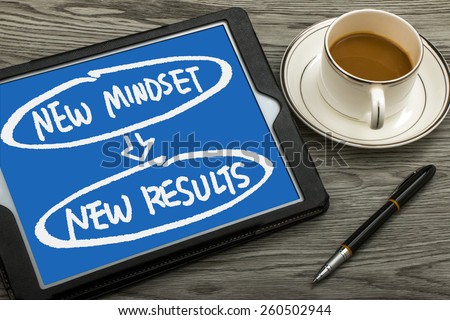 new mindset new results concept handwritten on tablet pc