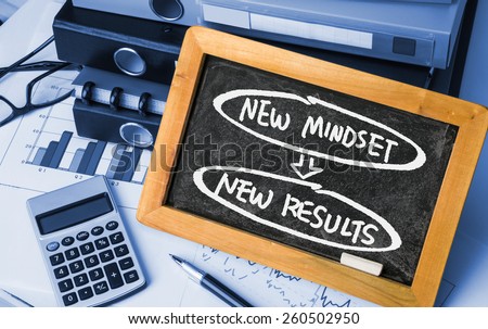 new mindset new results concept handwritten on blackboard