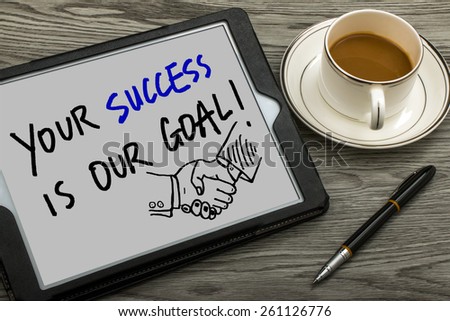 your success is our goal handwritten on tablet pc