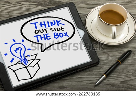 think outside the box concept hand drawing on tablet pc