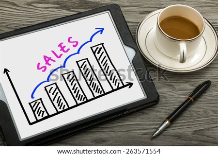 sales graph concept hand drawing on tablet pc